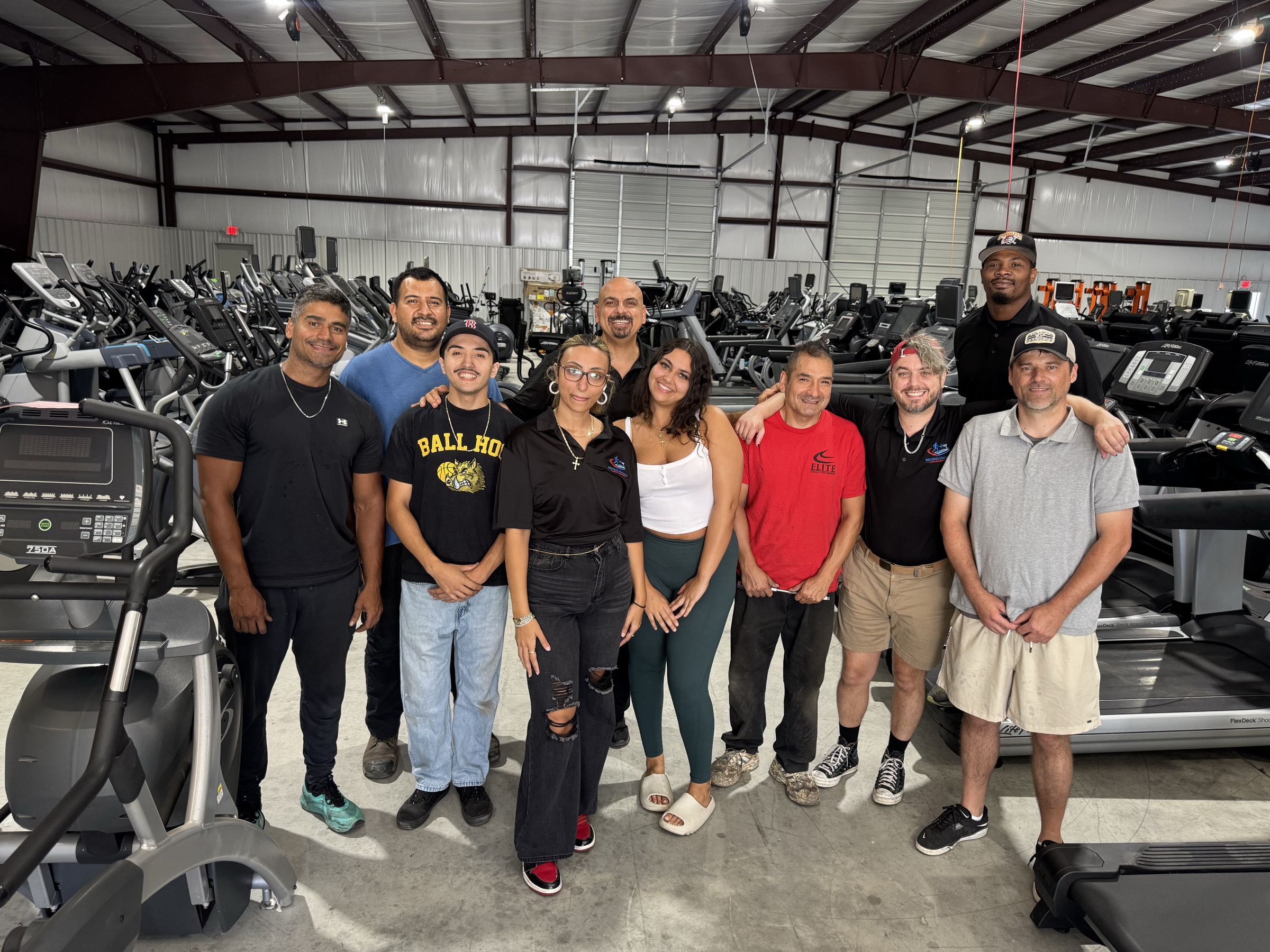 Second Chance Cardio team standing in the Buford equipment showroom
